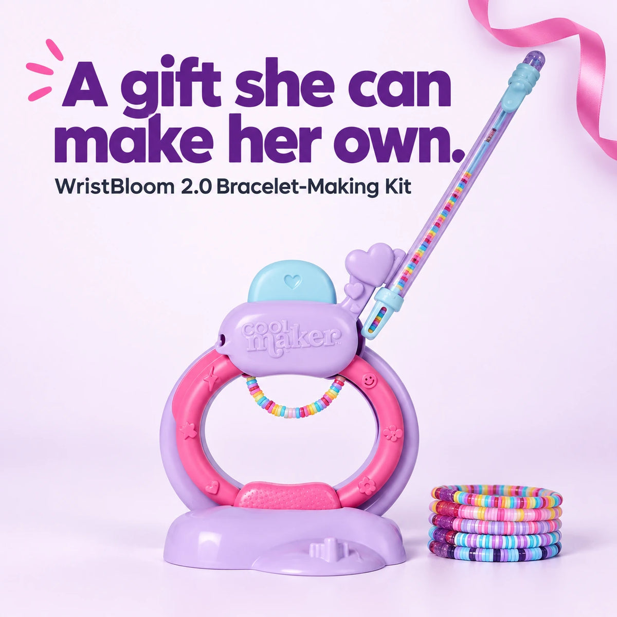 WristBloom 2.0 bracelet-making studio with a beading pen and examples of colorful finished bracelets.