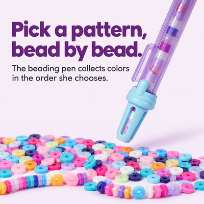 Close-up of the beading pen and colorful flat beads used to choose a bracelet pattern.